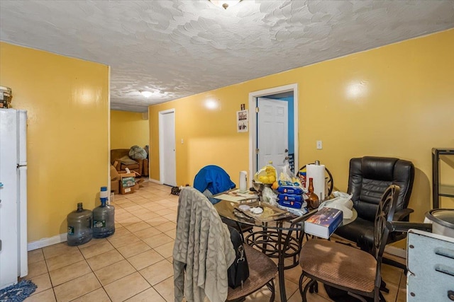135-07 223rd St, Laurelton, NY 11413 - dining space featuring light tile patterned flooring and a textured ceiling