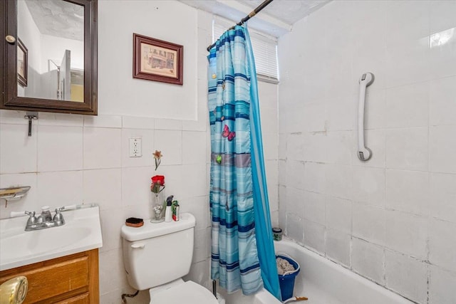 full bathroom featuring shower / tub combo, vanity, toilet, and tile walls