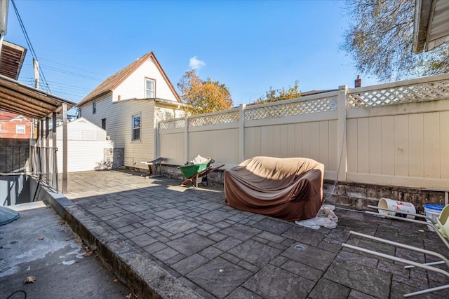 135-07 223rd St, Laurelton, NY 11413 - fenced backyard with a patio and a shed
