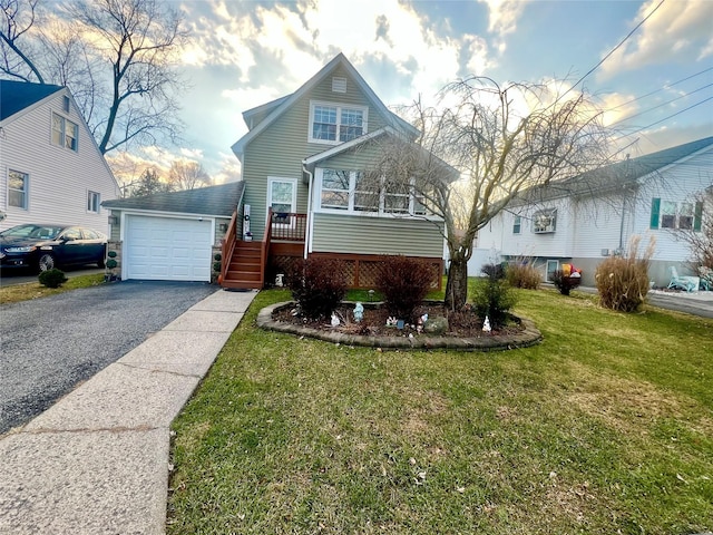 view of front of house featuring a front yard and a garage