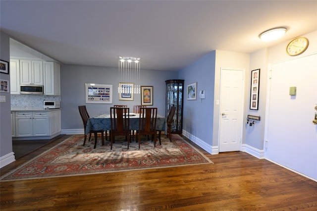 dining area featuring dark hardwood / wood-style floors