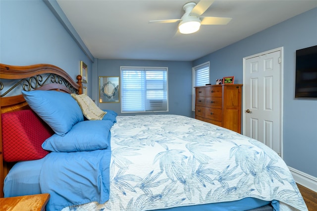 bedroom featuring ceiling fan and wood-type flooring