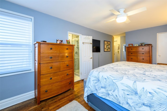 bedroom with ceiling fan, dark hardwood / wood-style flooring, and ensuite bath