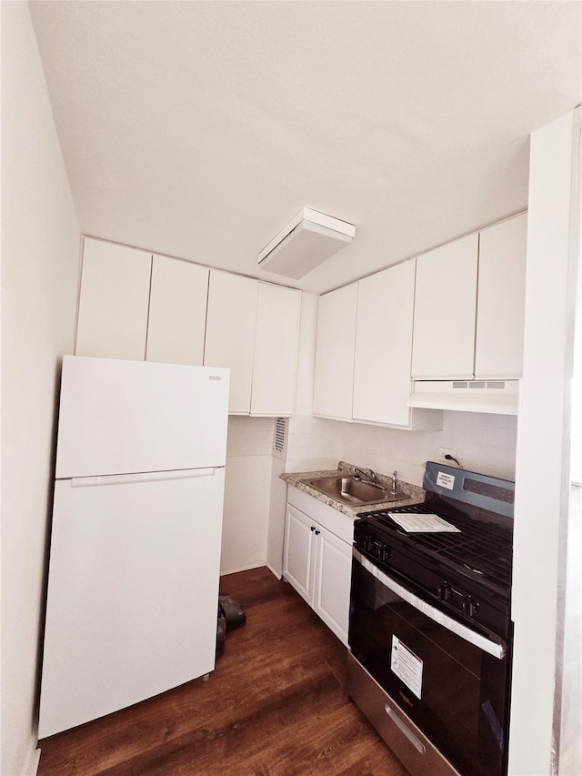 kitchen featuring stainless steel range, dark wood-type flooring, sink, white refrigerator, and white cabinets