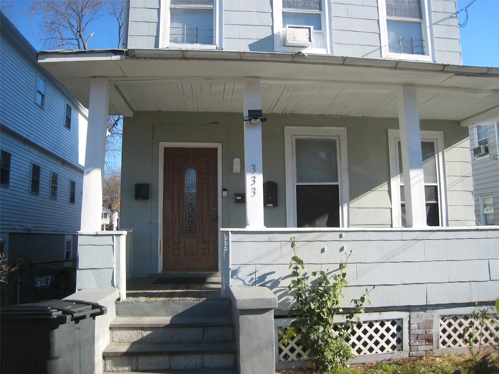 doorway to property with a porch