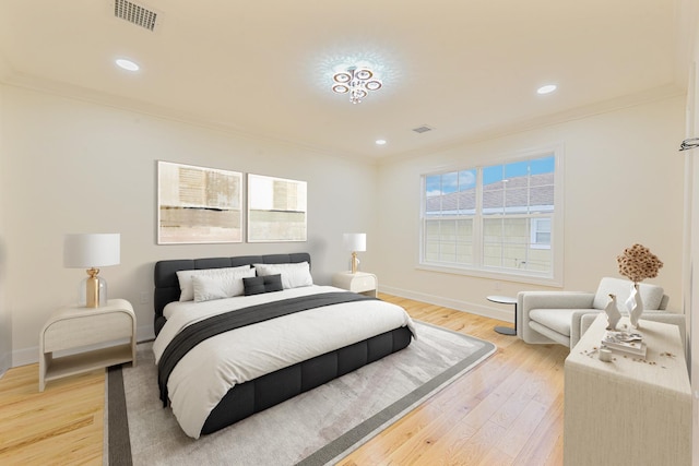 bedroom featuring hardwood / wood-style flooring and ornamental molding