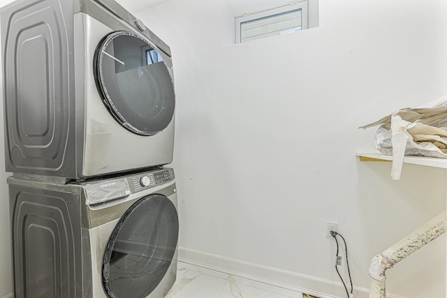 washroom featuring stacked washer and dryer