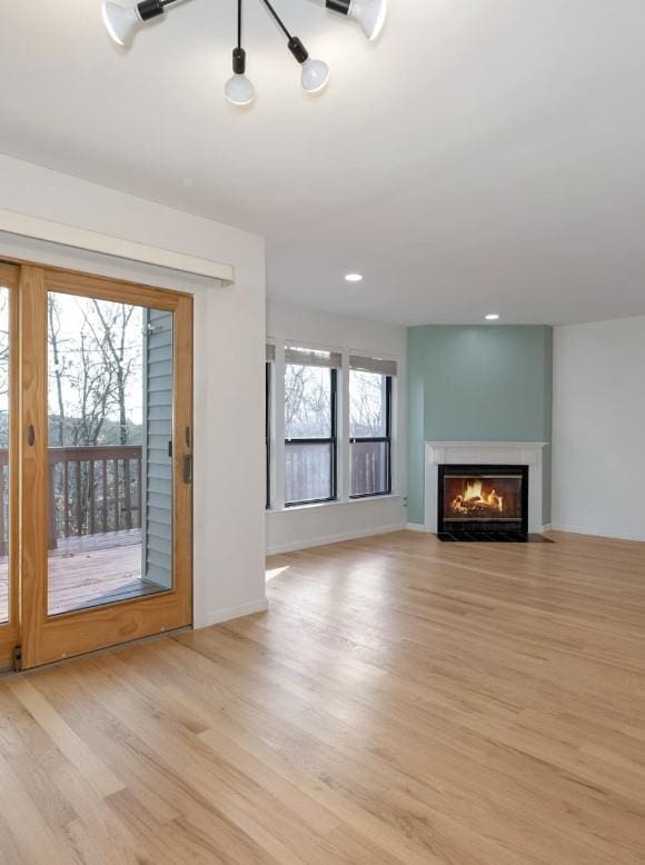 unfurnished living room featuring light hardwood / wood-style floors