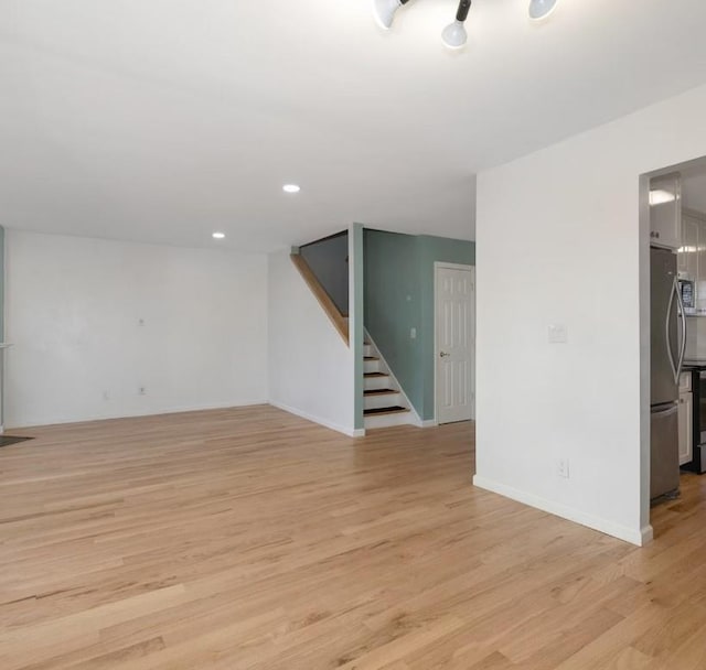 spare room with light wood-type flooring