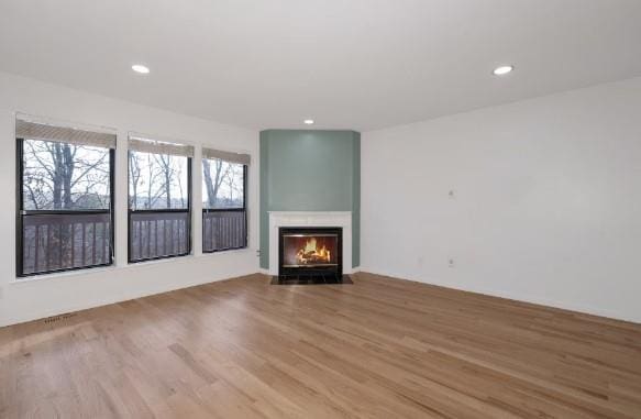 unfurnished living room with light hardwood / wood-style floors