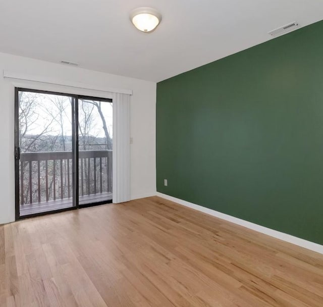 unfurnished room featuring light wood-type flooring