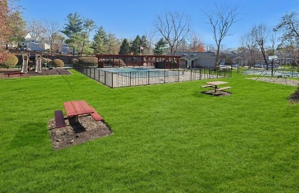 view of yard with a covered pool