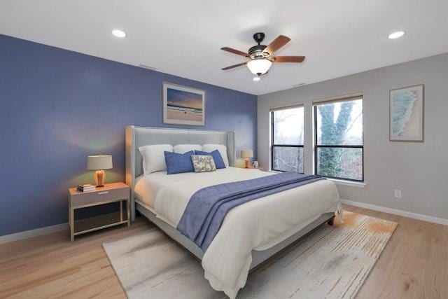 bedroom featuring ceiling fan and light hardwood / wood-style flooring