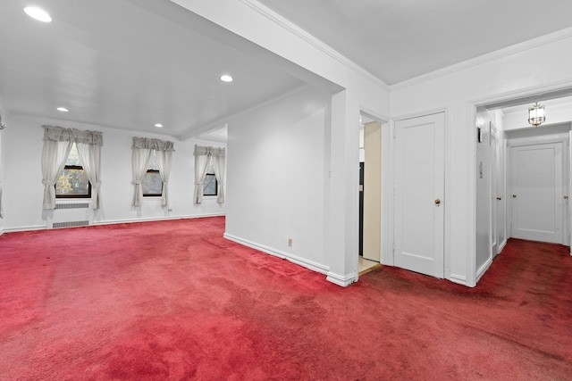 unfurnished living room featuring carpet flooring, crown molding, and radiator heating unit