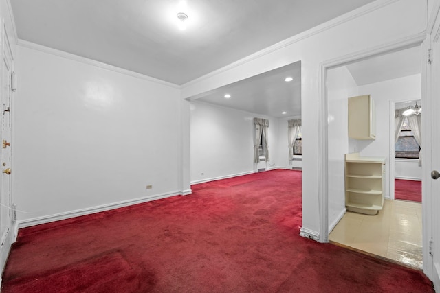 basement featuring carpet and ornamental molding