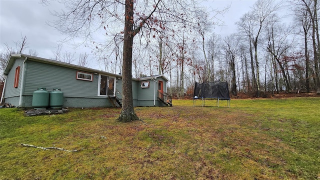 view of yard with a trampoline