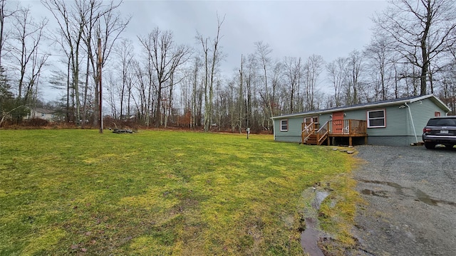 view of yard with a wooden deck