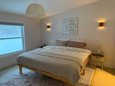 bedroom featuring wood-type flooring