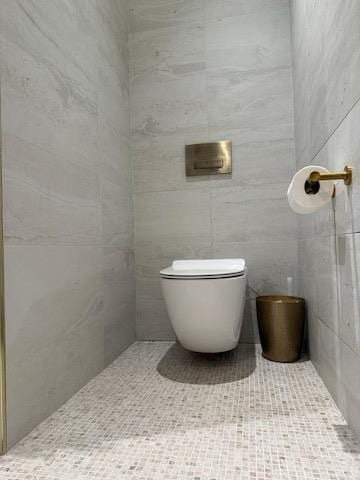 bathroom featuring toilet and tile patterned floors