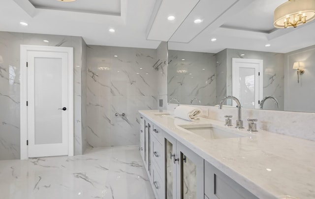 bathroom with a raised ceiling and vanity