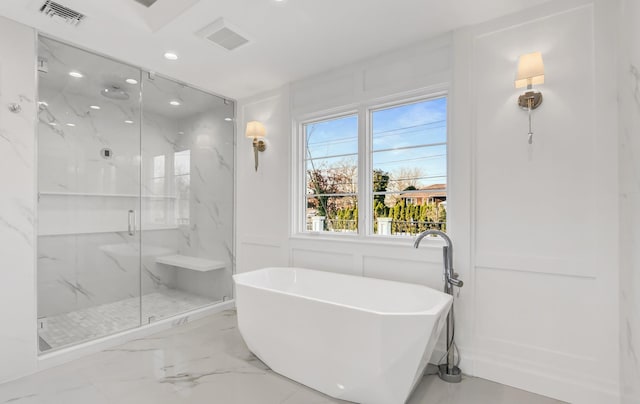 bathroom with shower with separate bathtub