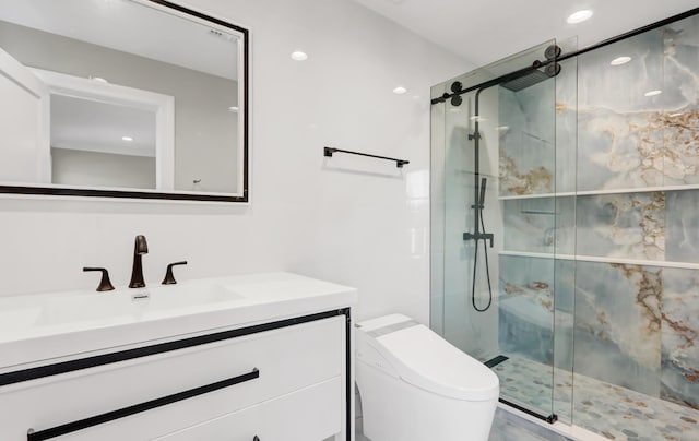 bathroom with vanity, toilet, and a shower with shower door