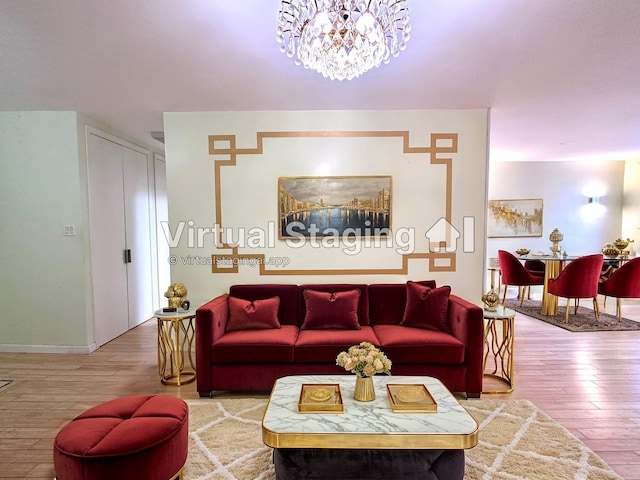 living room with hardwood / wood-style floors and a notable chandelier