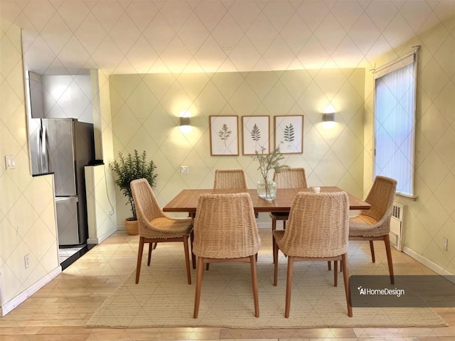 dining area with tile walls