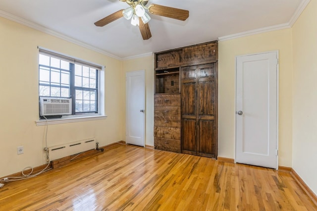 unfurnished bedroom featuring ornamental molding, a baseboard radiator, ceiling fan, and light hardwood / wood-style floors