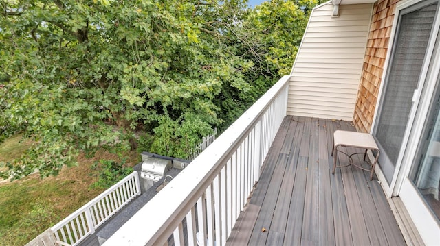 wooden terrace with area for grilling