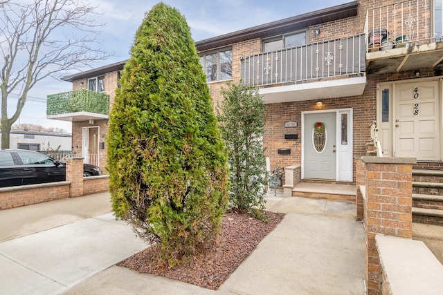 entrance to property with a balcony