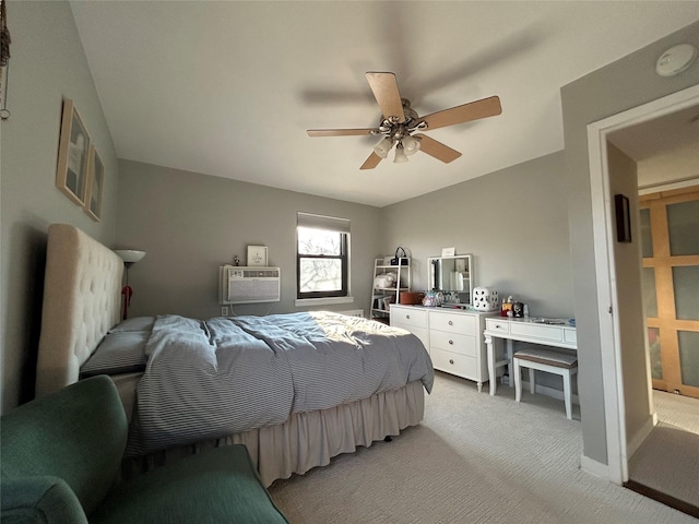 bedroom with ceiling fan, light carpet, and a wall mounted air conditioner