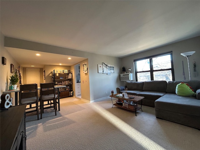 living room with light carpet and a wall mounted AC