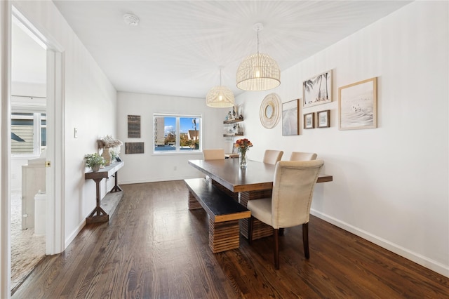 dining area with dark wood-type flooring