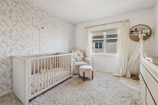 carpeted bedroom with a nursery area