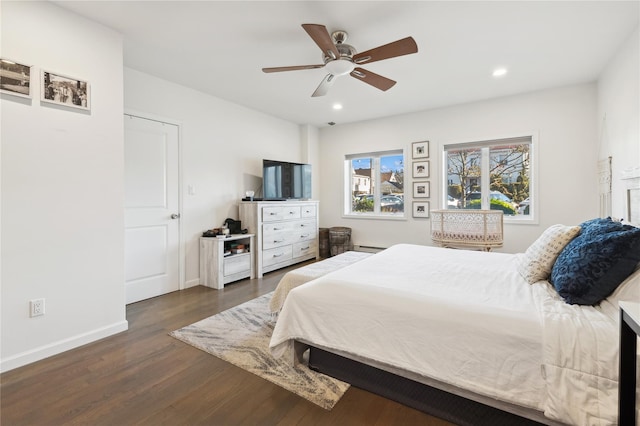 bedroom featuring ceiling fan and dark hardwood / wood-style floors