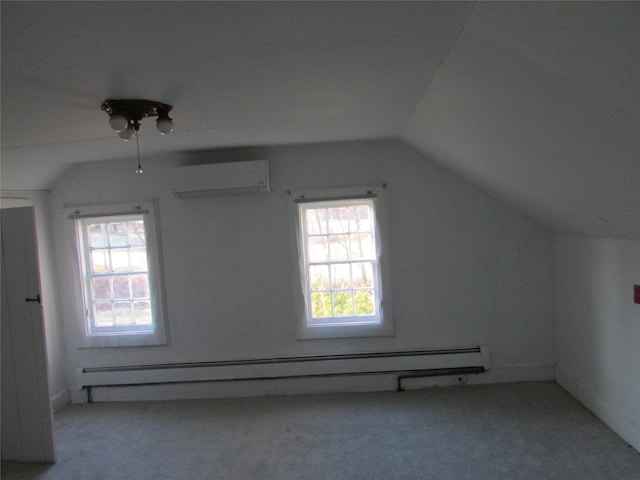 additional living space featuring a wealth of natural light, a baseboard radiator, a wall mounted AC, and lofted ceiling