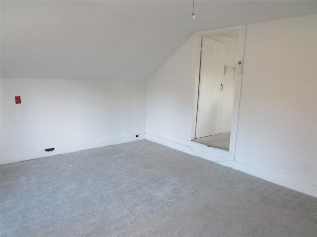 bonus room with carpet and lofted ceiling