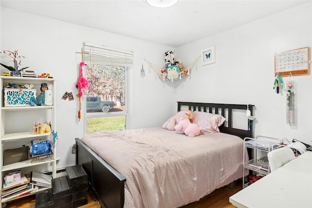 bedroom with dark wood-type flooring