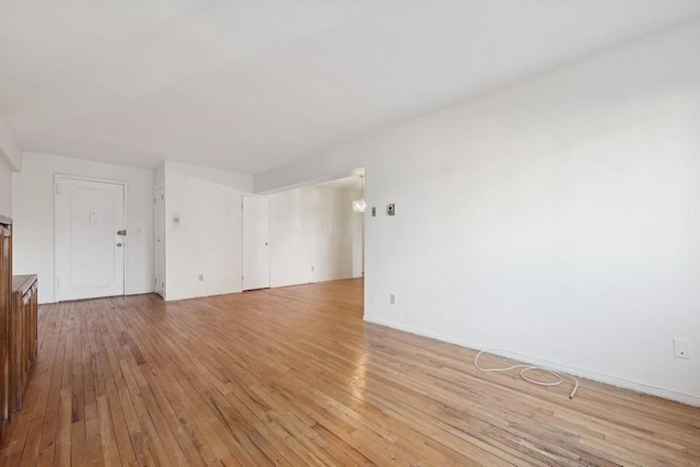 unfurnished room with light hardwood / wood-style floors