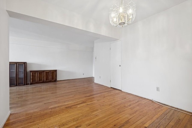 interior space featuring hardwood / wood-style floors and a chandelier