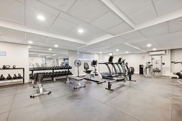 exercise room with a wall mounted air conditioner