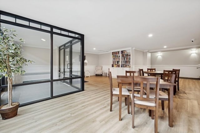 dining area featuring light wood-type flooring