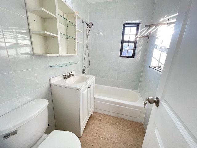 full bathroom featuring vanity, tile walls, tile patterned flooring, toilet, and tiled shower / bath