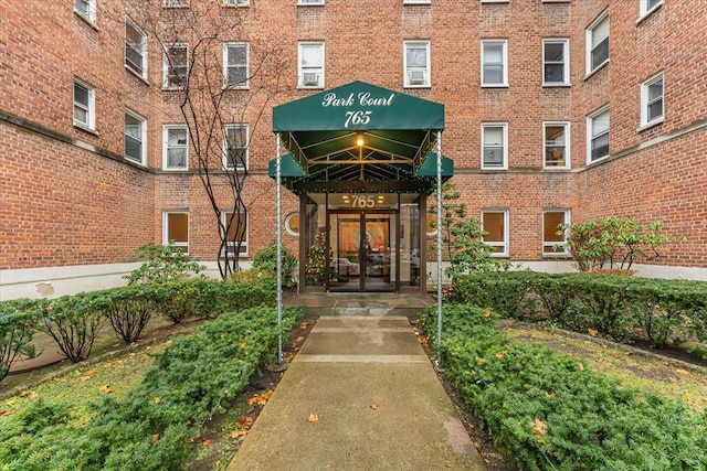 view of exterior entry featuring french doors