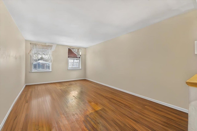 empty room with wood-type flooring