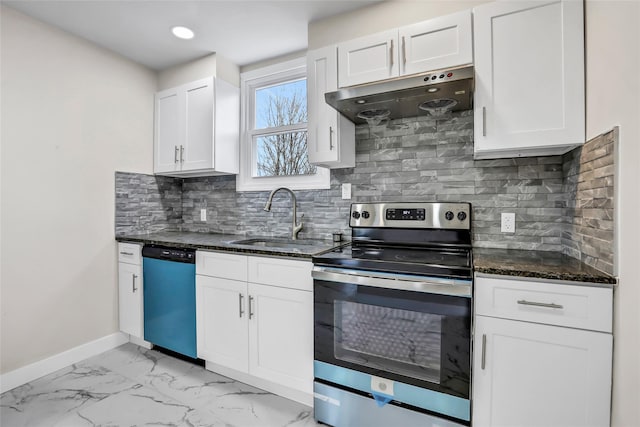 kitchen featuring backsplash, dark stone counters, sink, appliances with stainless steel finishes, and white cabinetry