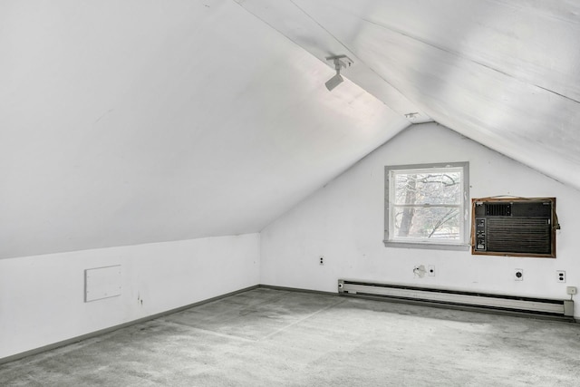 bonus room featuring a wall unit AC, light carpet, a baseboard radiator, and vaulted ceiling