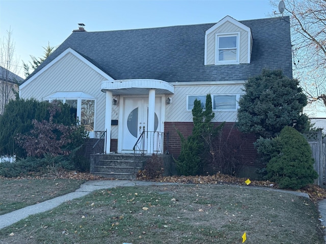 view of front of home with a front lawn