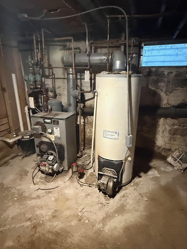 utility room featuring water heater